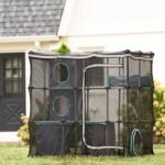 Kitty City Mega Catio Kit set up outdoors on a lawn